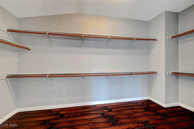 10135 Diving Duck Ave, Las Vegas, NV 89117 - walk in closet featuring wood finished floors and vaulted ceiling