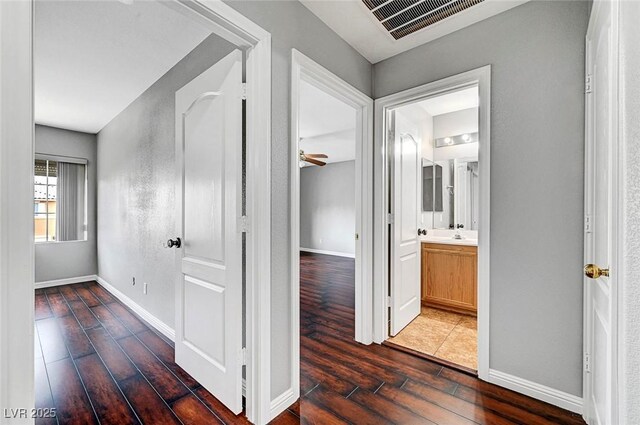 10135 Diving Duck Ave, Las Vegas, NV 89117 - hallway with wood finished floors and baseboards