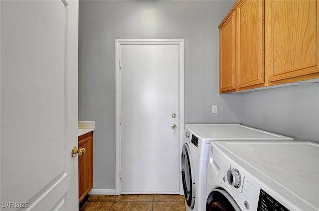 10135 Diving Duck Ave, Las Vegas, NV 89117 - laundry area featuring washing machine and dryer, cabinet space, and tile patterned floors