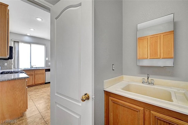 10135 Diving Duck Ave, Las Vegas, NV 89117 - bathroom with tile patterned flooring, vanity, and recessed lighting