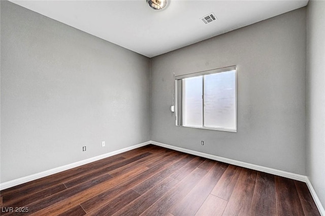 10135 Diving Duck Ave, Las Vegas, NV 89117 - unfurnished room with baseboards and dark wood finished floors