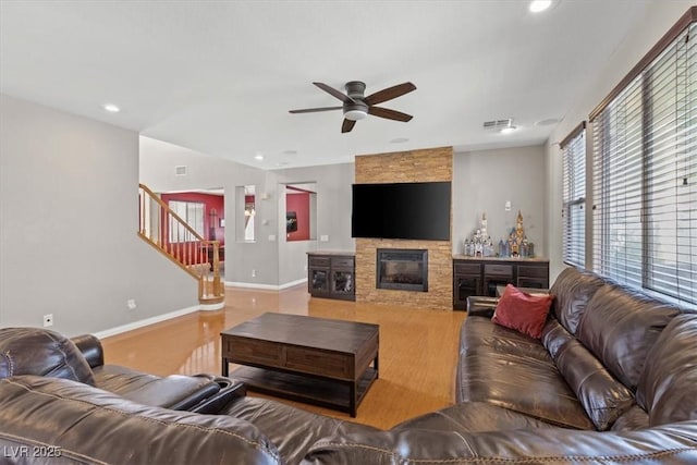 8723 Melissa Meadows St, Las Vegas, NV 89131 - living area featuring ceiling fan, stairway, baseboards, recessed lighting, and a fireplace