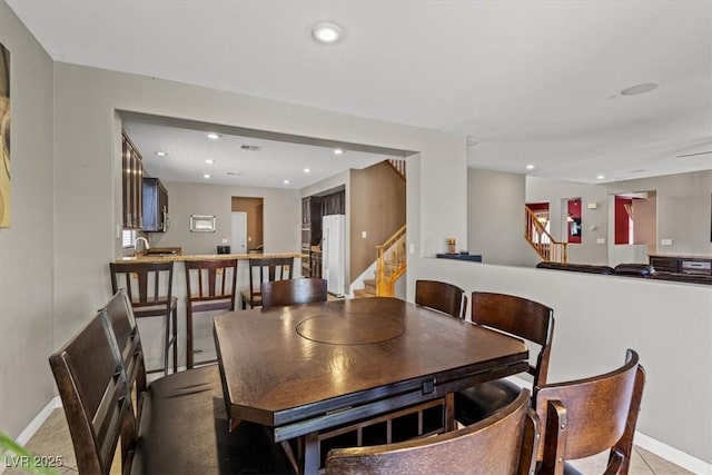 8723 Melissa Meadows St, Las Vegas, NV 89131 - dining space featuring stairs, baseboards, and recessed lighting