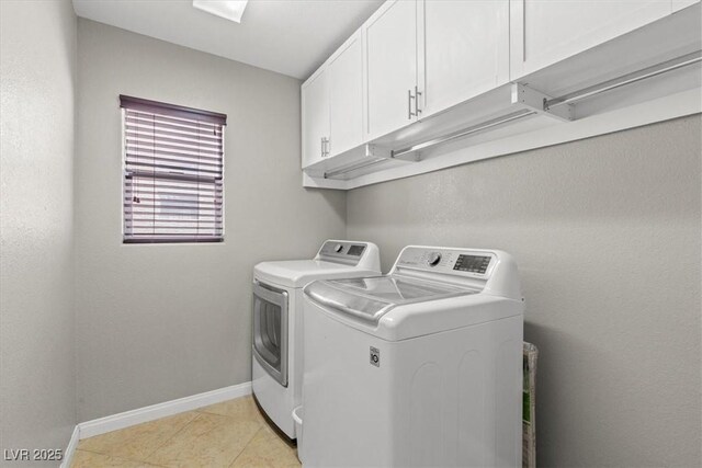 8723 Melissa Meadows St, Las Vegas, NV 89131 - clothes washing area featuring cabinet space, washer and clothes dryer, baseboards, and light tile patterned floors