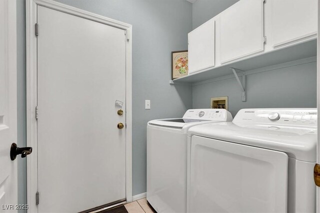 10046 Floragold Ct, Las Vegas, NV 89147 - laundry area featuring independent washer and dryer, cabinet space, and light tile patterned floors
