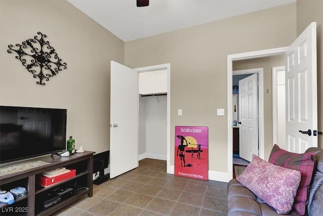 10046 Floragold Ct, Las Vegas, NV 89147 - tiled living area with a ceiling fan and baseboards