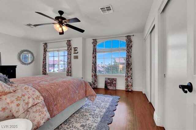 10046 Floragold Ct, Las Vegas, NV 89147 - bedroom featuring wood finished floors, baseboards, and ceiling fan