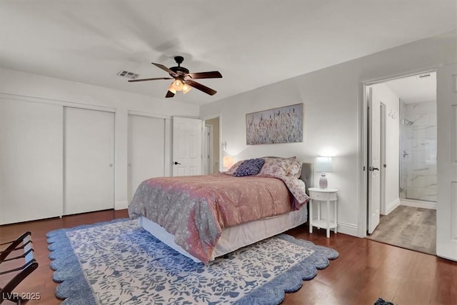 10046 Floragold Ct, Las Vegas, NV 89147 - bedroom featuring two closets, wood finished floors, ensuite bathroom, a ceiling fan, and baseboards