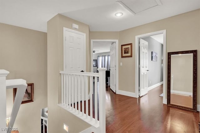 10046 Floragold Ct, Las Vegas, NV 89147 - hall featuring an upstairs landing, wood finished floors, and baseboards