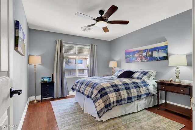 10046 Floragold Ct, Las Vegas, NV 89147 - bedroom with baseboards, wood finished floors, and ceiling fan