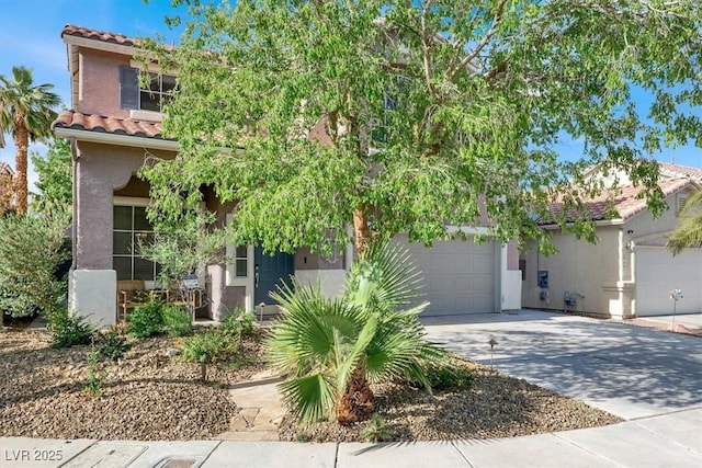 10046 Floragold Ct, Las Vegas, NV 89147 - obstructed view of property featuring a tiled roof, stucco siding, concrete driveway, and a garage