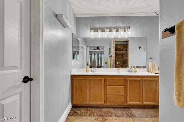 10046 Floragold Ct, Las Vegas, NV 89147 - full bath featuring double vanity, ceiling fan, and baseboards