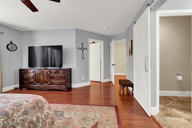 10046 Floragold Ct, Las Vegas, NV 89147 - bedroom with wood finished floors, baseboards, and a ceiling fan