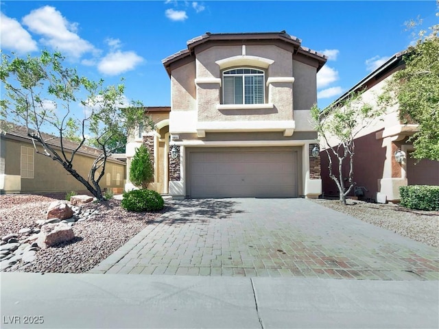 10056 Cranbrook Falls Ct, Las Vegas, NV 89148 - view of front of home with stucco siding, decorative driveway, and a garage