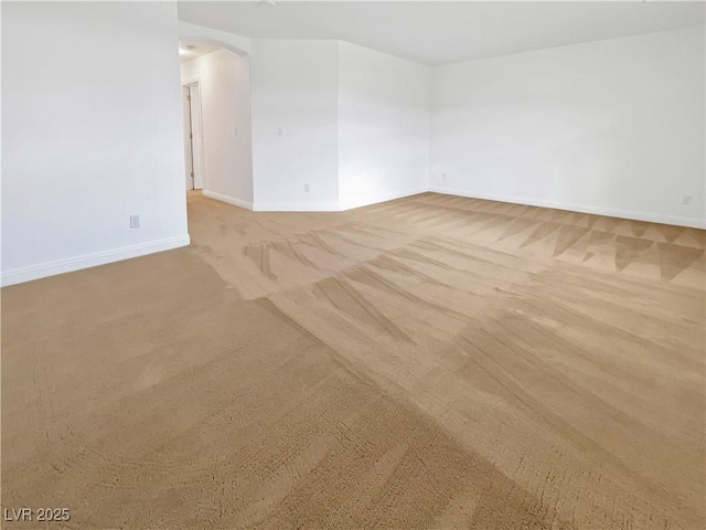 10056 Cranbrook Falls Ct, Las Vegas, NV 89148 - unfurnished room featuring carpet floors, arched walkways, and baseboards