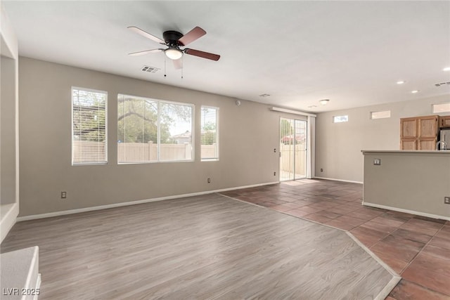 4705 Delicate Arch Ct, North Las Vegas, NV 89031 - unfurnished living room with ceiling fan, baseboards, recessed lighting, and wood finished floors