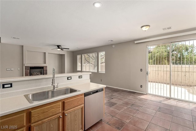 4705 Delicate Arch Ct, North Las Vegas, NV 89031 - kitchen with dishwasher, a sink, a ceiling fan, and plenty of natural light