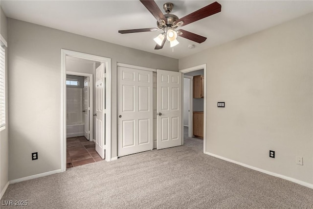 4705 Delicate Arch Ct, North Las Vegas, NV 89031 - unfurnished bedroom featuring carpet, baseboards, ensuite bathroom, ceiling fan, and a closet