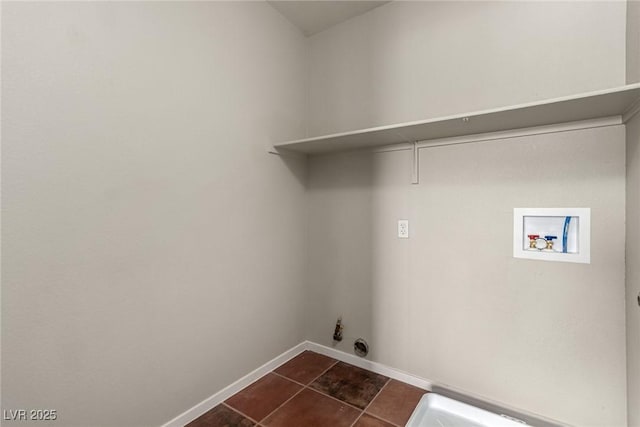 4705 Delicate Arch Ct, North Las Vegas, NV 89031 - laundry area featuring hookup for a washing machine, gas dryer hookup, baseboards, and dark tile patterned floors
