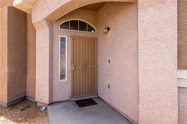 4705 Delicate Arch Ct, North Las Vegas, NV 89031 - doorway to property with stucco siding