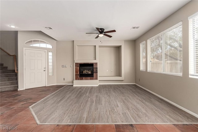 4705 Delicate Arch Ct, North Las Vegas, NV 89031 - unfurnished living room with a ceiling fan, stairs, and baseboards