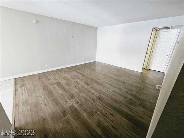 1405 Vegas Valley Dr Unit 380, Las Vegas, NV 89169 - unfurnished room featuring dark wood-type flooring and baseboards