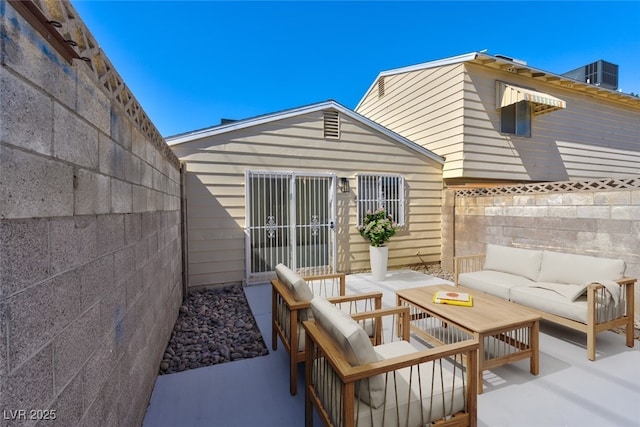 view of patio / terrace featuring an outdoor hangout area and fence