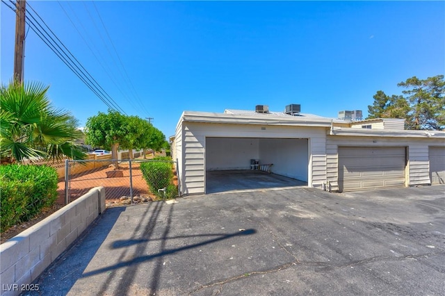 garage featuring fence