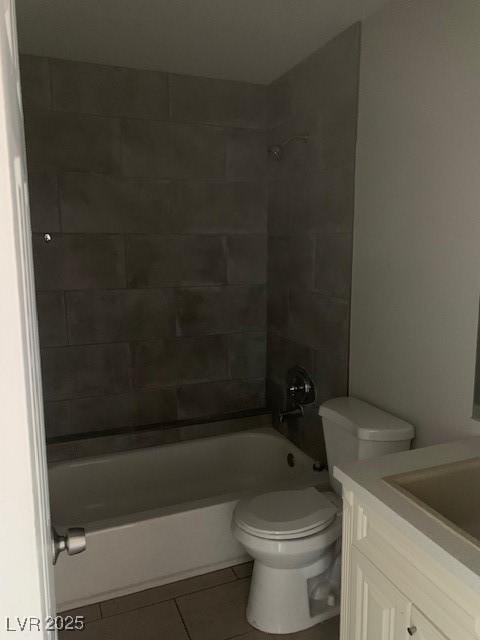 bathroom with tile patterned flooring, toilet, shower / bath combination, and vanity