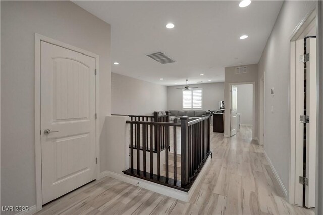 205 Piedmont Alps St, Henderson, NV 89012 - hall featuring light wood-style flooring, an upstairs landing, and recessed lighting