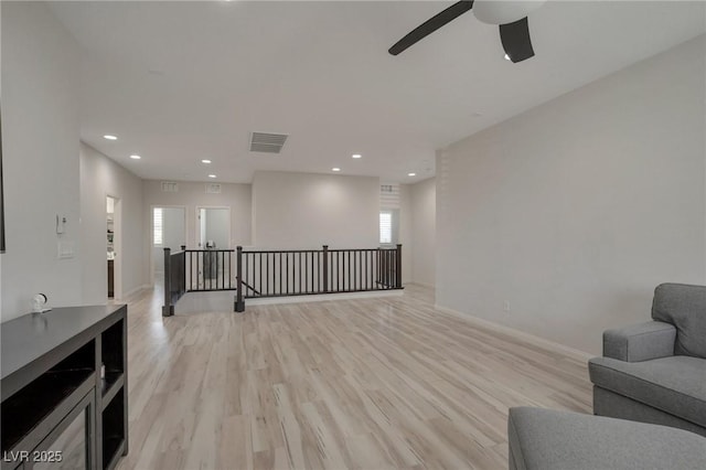205 Piedmont Alps St, Henderson, NV 89012 - living area with an upstairs landing, recessed lighting, a ceiling fan, and light wood-style floors