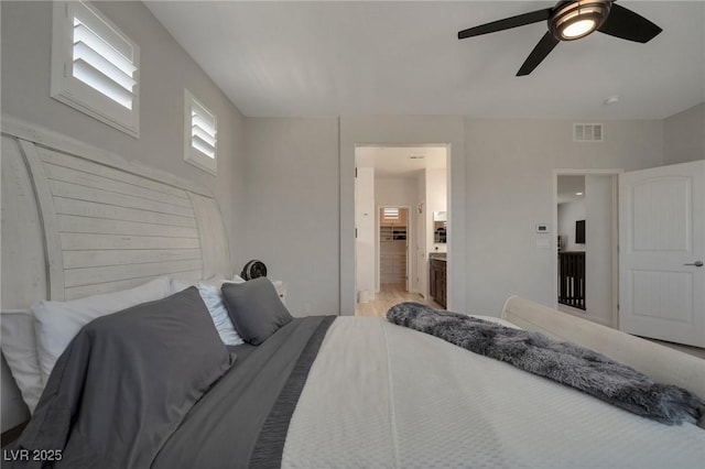 205 Piedmont Alps St, Henderson, NV 89012 - bedroom featuring ensuite bathroom, a ceiling fan, and wood finished floors