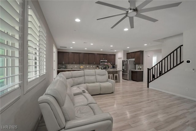 205 Piedmont Alps St, Henderson, NV 89012 - living area featuring ceiling fan, recessed lighting, stairs, light wood-style floors, and baseboards