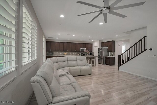 205 Piedmont Alps St, Henderson, NV 89012 - living room featuring ceiling fan, recessed lighting, stairway, and light wood-style flooring