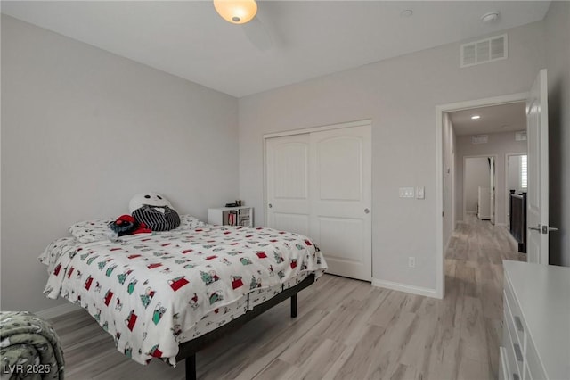 205 Piedmont Alps St, Henderson, NV 89012 - bedroom with light wood finished floors, a closet, and baseboards
