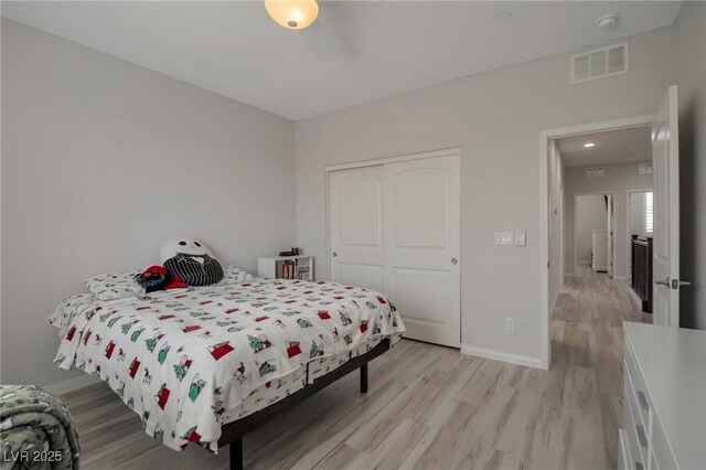 205 Piedmont Alps St, Henderson, NV 89012 - bedroom with light wood finished floors and a closet