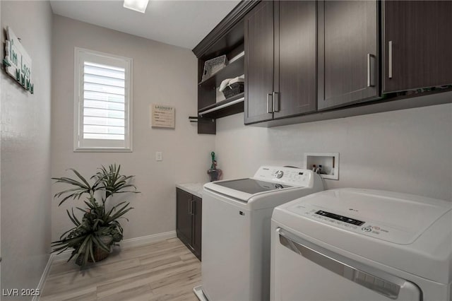 205 Piedmont Alps St, Henderson, NV 89012 - laundry area featuring washer and clothes dryer, cabinet space, light wood-type flooring, and baseboards