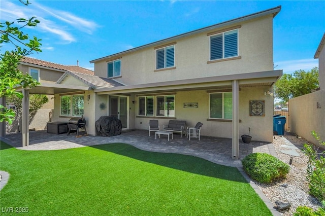 205 Piedmont Alps St, Henderson, NV 89012 - rear view of property with stucco siding, an outdoor hangout area, and a patio