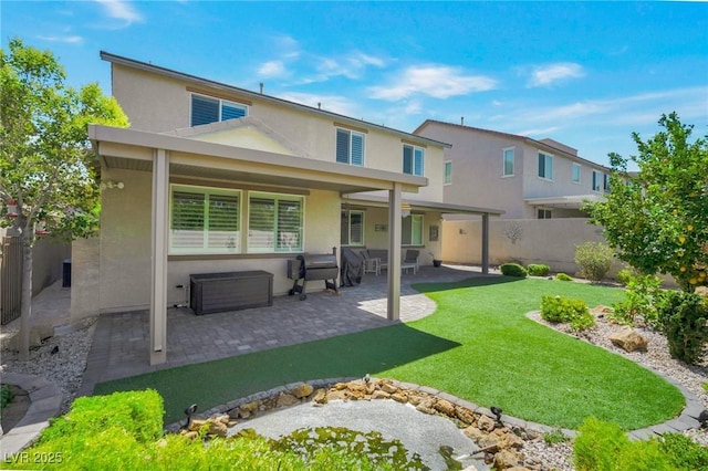 205 Piedmont Alps St, Henderson, NV 89012 - back of house with stucco siding and a patio area