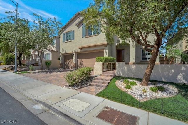205 Piedmont Alps St, Henderson, NV 89012 - view of front of house with a garage, stucco siding, and driveway