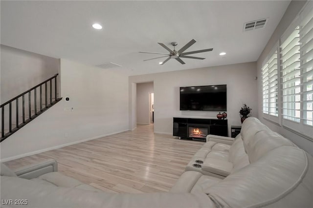 205 Piedmont Alps St, Henderson, NV 89012 - living room featuring a ceiling fan, light wood-style flooring, stairway, recessed lighting, and baseboards