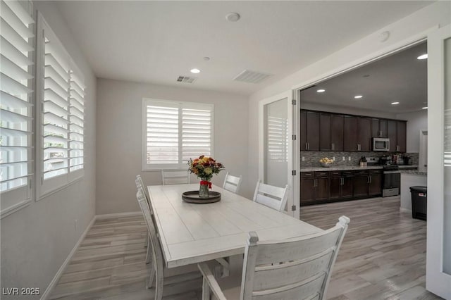 205 Piedmont Alps St, Henderson, NV 89012 - dining area with healthy amount of natural light, light wood-type flooring, recessed lighting, and baseboards