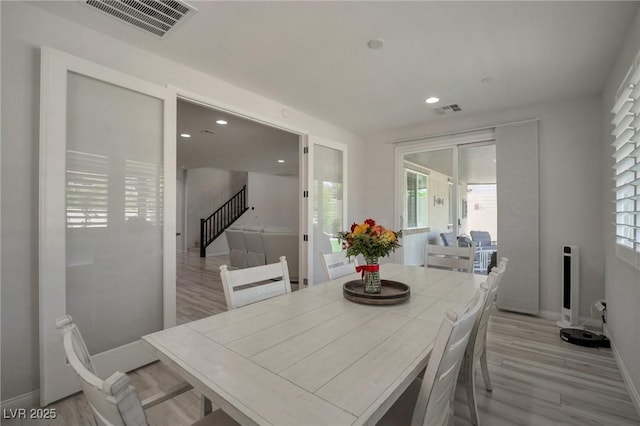 205 Piedmont Alps St, Henderson, NV 89012 - dining area with light wood finished floors, stairs, baseboards, and recessed lighting