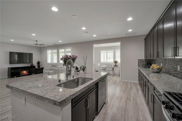 205 Piedmont Alps St, Henderson, NV 89012 - kitchen featuring stainless steel appliances, recessed lighting, plenty of natural light, a ceiling fan, and tasteful backsplash