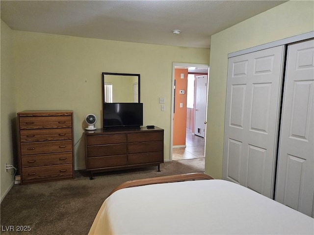 bedroom featuring carpet floors, a closet, and baseboards