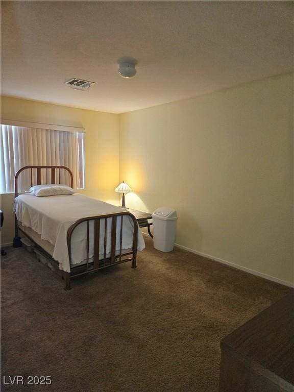 carpeted bedroom with baseboards