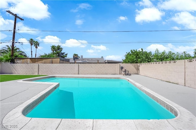 view of pool featuring a fenced backyard and a patio