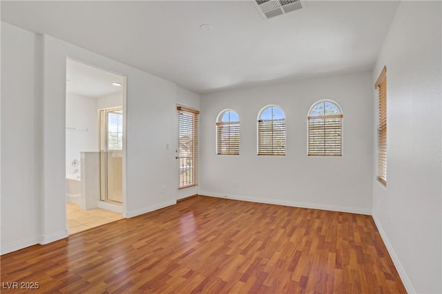 11247 Villa Trentino Ct, Las Vegas, NV 89141 - empty room featuring wood finished floors, healthy amount of natural light, and baseboards