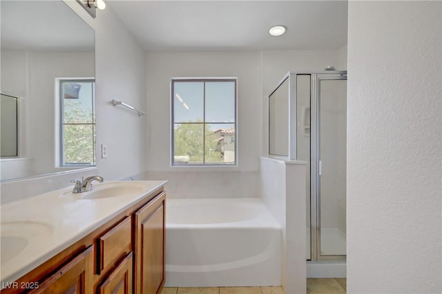 11247 Villa Trentino Ct, Las Vegas, NV 89141 - full bath featuring a shower stall, a bath, double vanity, and tile patterned floors