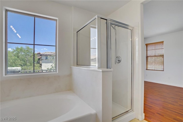 11247 Villa Trentino Ct, Las Vegas, NV 89141 - full bath with a stall shower, a bath, and wood finished floors